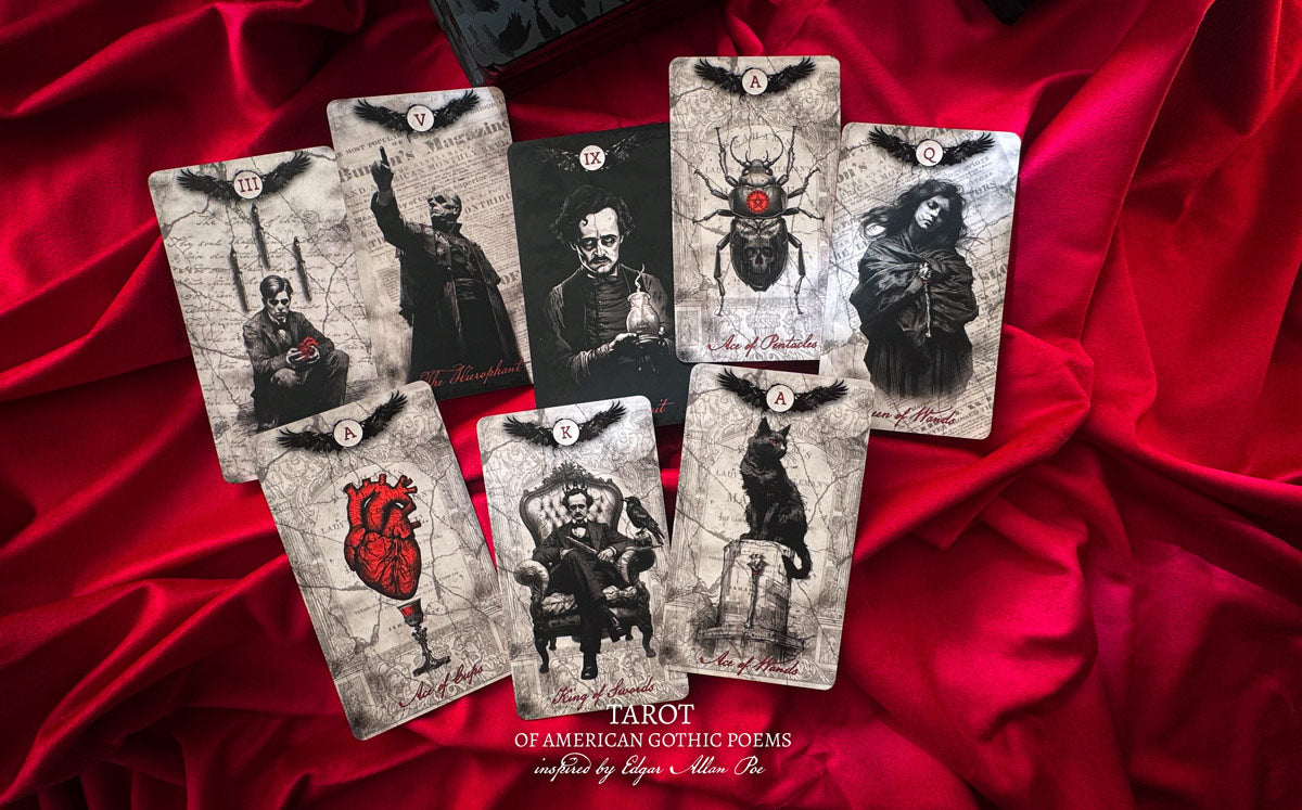 Set of tarot cards with gothic designs on a red fabric background