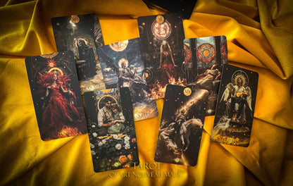 Collection of tarot cards on a yellow fabric background