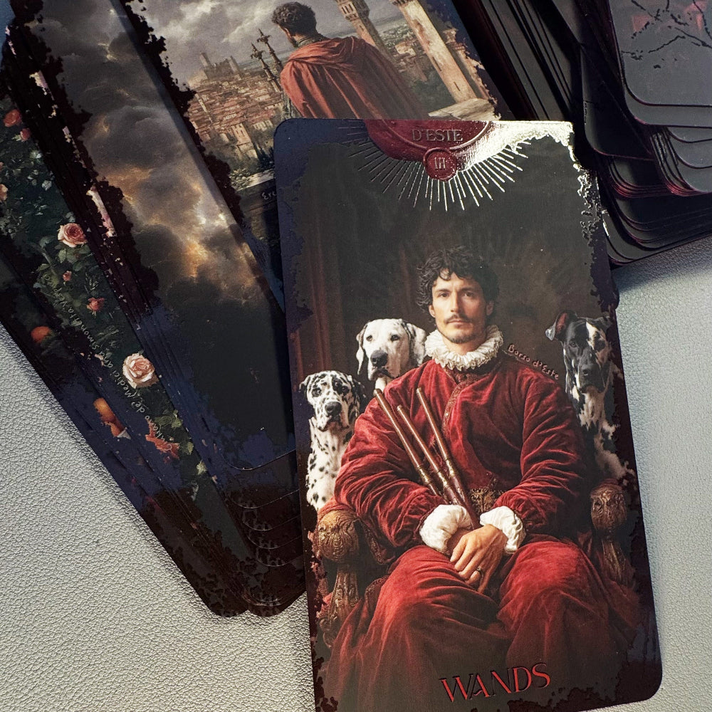 Tarot cards with a central card featuring a person in red attire and dogs, surrounded by other tarot cards.